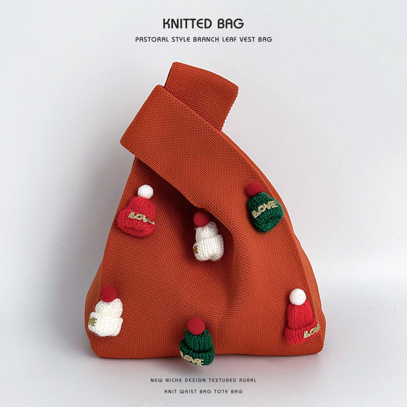 Bolso de muñeca de punto hecho a mano con gorro navideño