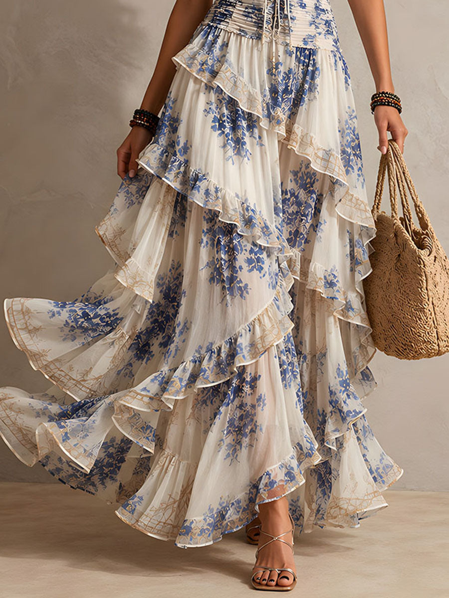 Vestido maxi romántico de vacaciones con estampado floral azul y blanco, cuello halter y volantes