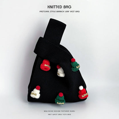 Bolso de muñeca de punto hecho a mano con gorro navideño