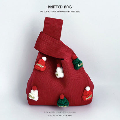 Bolso de muñeca de punto hecho a mano con gorro navideño
