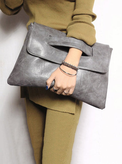 Bolso clutch magnético de gran capacidad con correa bandolera