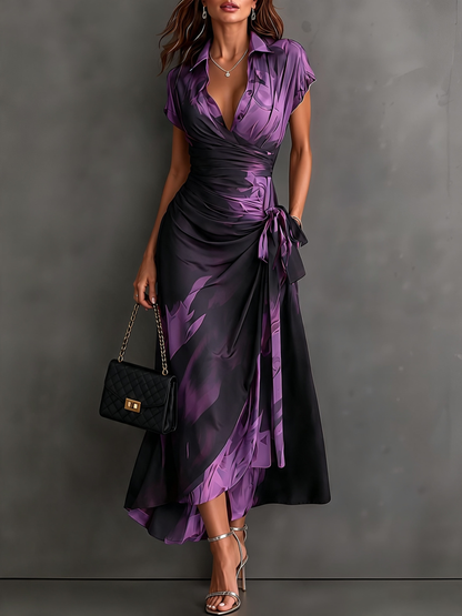 Vestido midi cruzado con estampado abstracto rojo y negro, cuello camisero en V, manga corta, lazo en la cintura y bajo asimétrico con volantes
