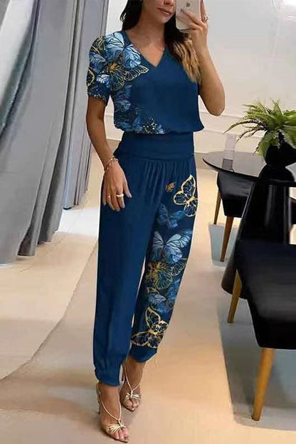 Conjunto casual de dos piezas: top estampado de manga corta con cuello en V y pantalón largo