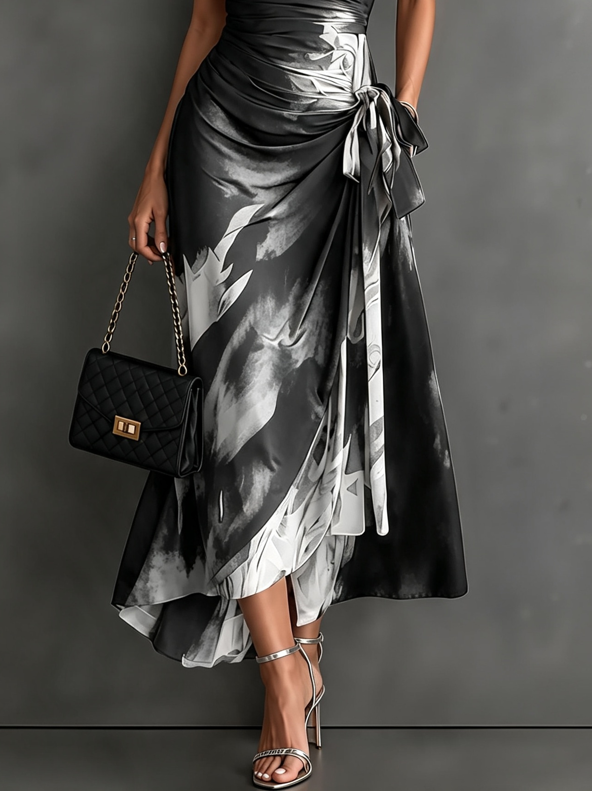 Vestido midi cruzado con estampado abstracto rojo y negro, cuello camisero en V, manga corta, lazo en la cintura y bajo asimétrico con volantes