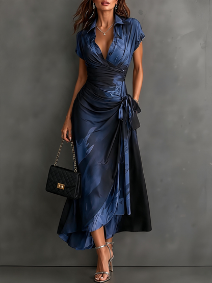 Vestido midi cruzado con estampado abstracto rojo y negro, cuello camisero en V, manga corta, lazo en la cintura y bajo asimétrico con volantes