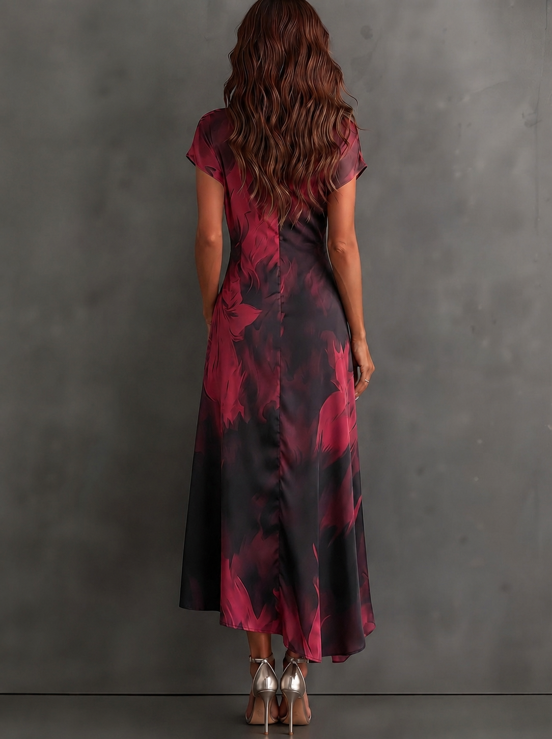 Vestido midi cruzado con estampado abstracto rojo y negro, cuello camisero en V, manga corta, lazo en la cintura y bajo asimétrico con volantes
