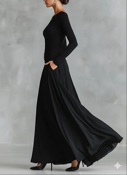 Vestido largo negro de crepé plisado con escote barco