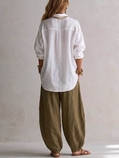 Conjunto de camisa holgada blanca y pantalón farol de pierna ancha verde