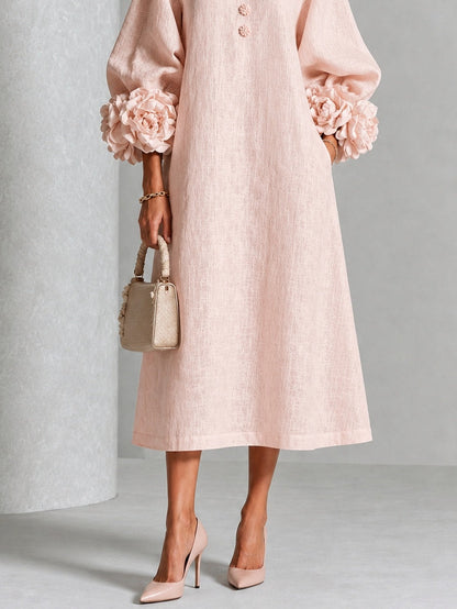 Vestido midi floral rosa abotonado con llamativos puños florales