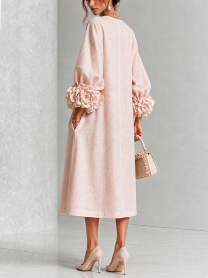 Vestido midi floral rosa abotonado con llamativos puños florales