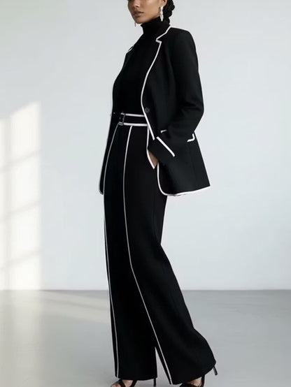 Traje de dos piezas negro: blazer con vivos en contraste y pantalón de pierna ancha