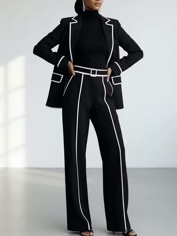 Traje de dos piezas negro: blazer con vivos en contraste y pantalón de pierna ancha