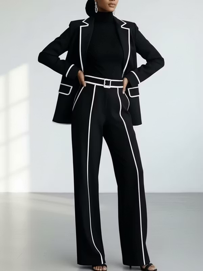 Traje de dos piezas negro: blazer con vivos en contraste y pantalón de pierna ancha