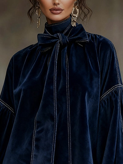 Minivestido de terciopelo azul oscuro con lazo y manga farol
