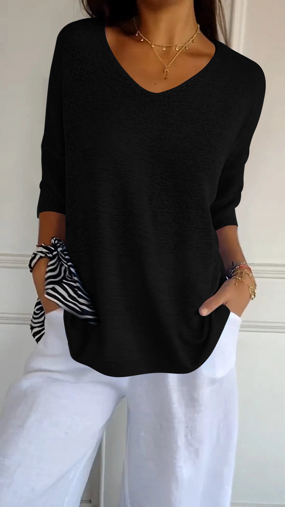 Top de punto liso con cuello en V