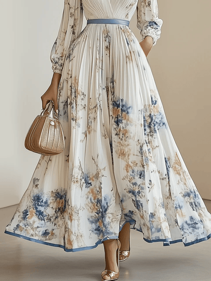 Vestido largo blanco de gasa plisada con flores, cuello en V y manga larga abullonada