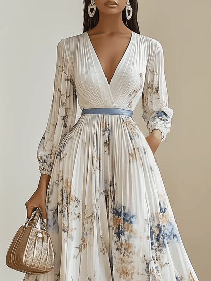 Vestido largo blanco de gasa plisada con flores, cuello en V y manga larga abullonada