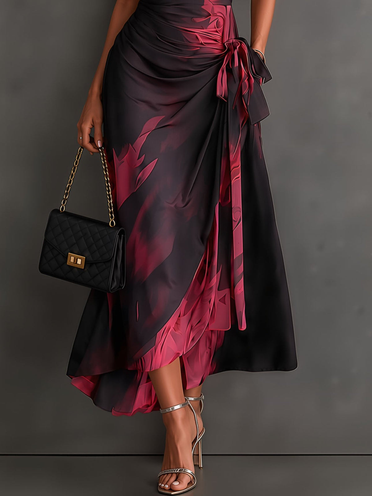 Vestido midi cruzado con estampado abstracto rojo y negro, cuello camisero en V, manga corta, lazo en la cintura y bajo asimétrico con volantes
